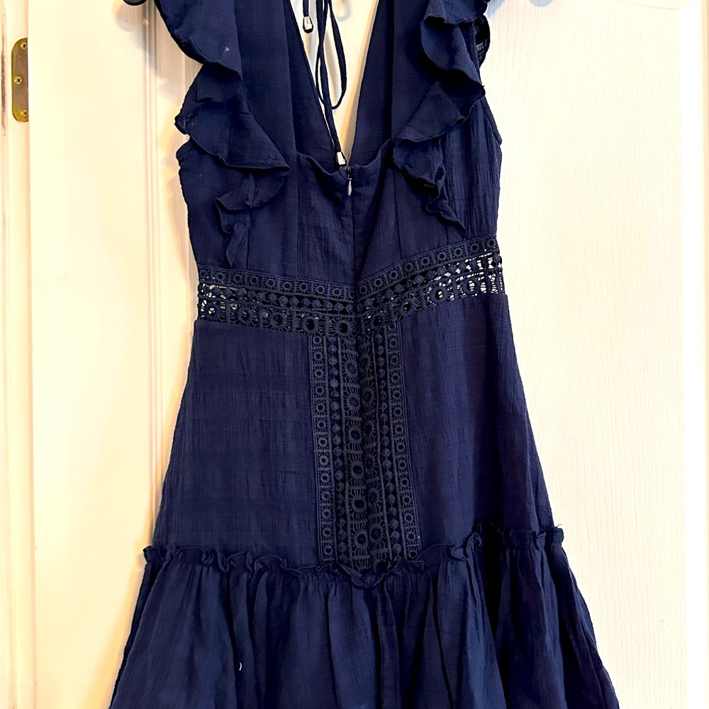 Mid length, sleeveless cotton dress with crocheted embellishments